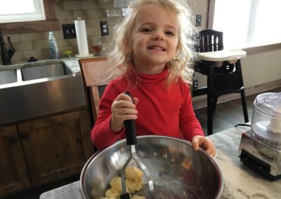 Charlie mashing the muffins